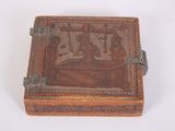 a small wooden box with a painting on it