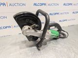 a close up of a circular cutter on a table in front of a wall