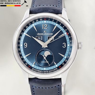 a close up of a wrist watch with a blue dial