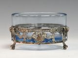 a glass bowl with a gold and blue design on it