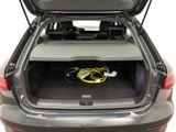the back of a car with the trunk open and a power cord in the trunk