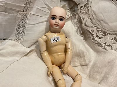 Tête poupée porcelaine biscuit numérotée - Yeux de verre