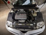 a picture of a car with its hood open and the hood up