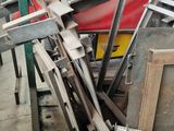 several pieces of metal are stacked on top of each other in a garage