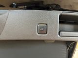 a close up of a button on a car ' s dashboard