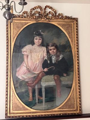 a painting of a boy and a girl on a mantle