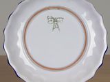 a plate with a picture of a cat on it on a table