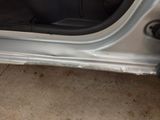 a picture of a car door with a hole in it