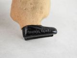 a close up view of a wooden duck head with a rubber foot