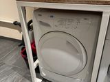 a washer and dryer in the corner of a kitchen