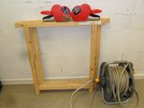 a picture of a table with a hose and a pair of scissors on top of it