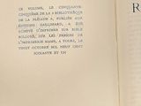 an open book with a picture of a cat on it