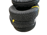 two tires stacked on top of each other on a white background