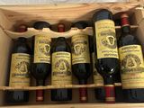 six bottles of wine in a wooden box