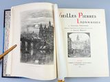 a book opened to show a drawing of a castle