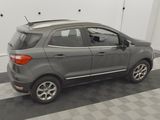 an image of a grey car parked in a garage
