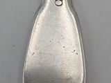 a silver spoon with a number on it on a white surface