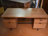 an image of a wooden desk with two drawers on it
