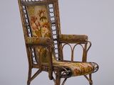 une image d'une chaise dont l'assise est recouverte d'un rembourrage floral
