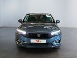 the front view of a blue car parked in a showroom