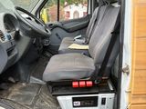an image of the inside of a van with the driver ' s seat up