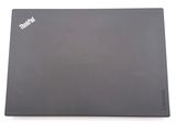 a laptop that is sitting on a white surface