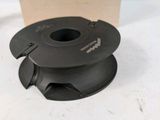 a black spool sitting on a table next to a wooden box