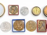 several different types of coins are arranged in a row
