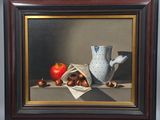 tableau encadré représentant un vase et des fruits posés sur une table