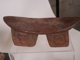 a wooden bench that is on display in a museum