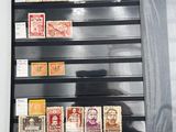 a picture of a collection of stamps on display in a case