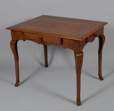 an old wooden table with a drawer underneath it on a gray surface