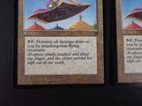 these are two cards with a picture of a woman riding a flying saucer