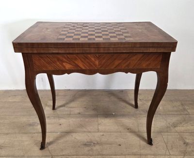 an image of a wooden table with a chess board on it