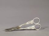 a pair of scissors that are sitting on a table