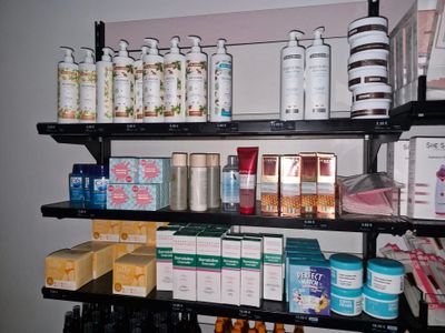 many different types of products on the shelves in the room