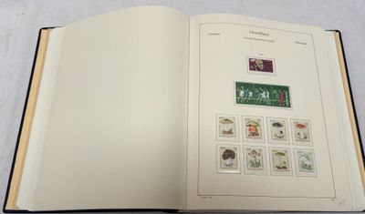 an open book with stamps on it sitting on a table