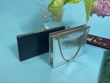 two purses sitting next to each other on a table