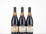 three bottles of wine sitting on top of a table next to each other