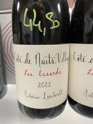 two bottles of wine that are on a table