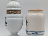 two vases sitting next to each other on a table