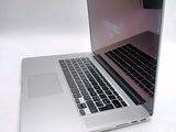 a close up of a laptop computer on a white surface