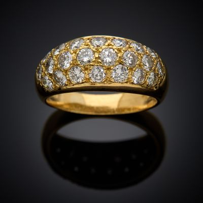 an 18k gold and diamond band ring