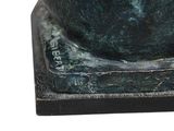 a close up of a statue of a cat on a base