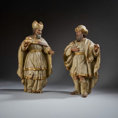 pair of carved wood figures of a man and a woman