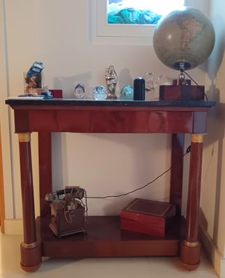 a small table with a globe on top of it