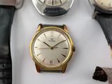 three different types of watches sitting on a table