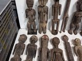 a lot of wooden figurines that are on a table