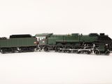 a toy train that is on the tracks in the snow