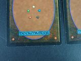 two cards with different designs on them sitting on a table